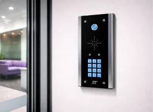 Intercom system for business installed on office wall beside glass door with keypad entry and secure access control