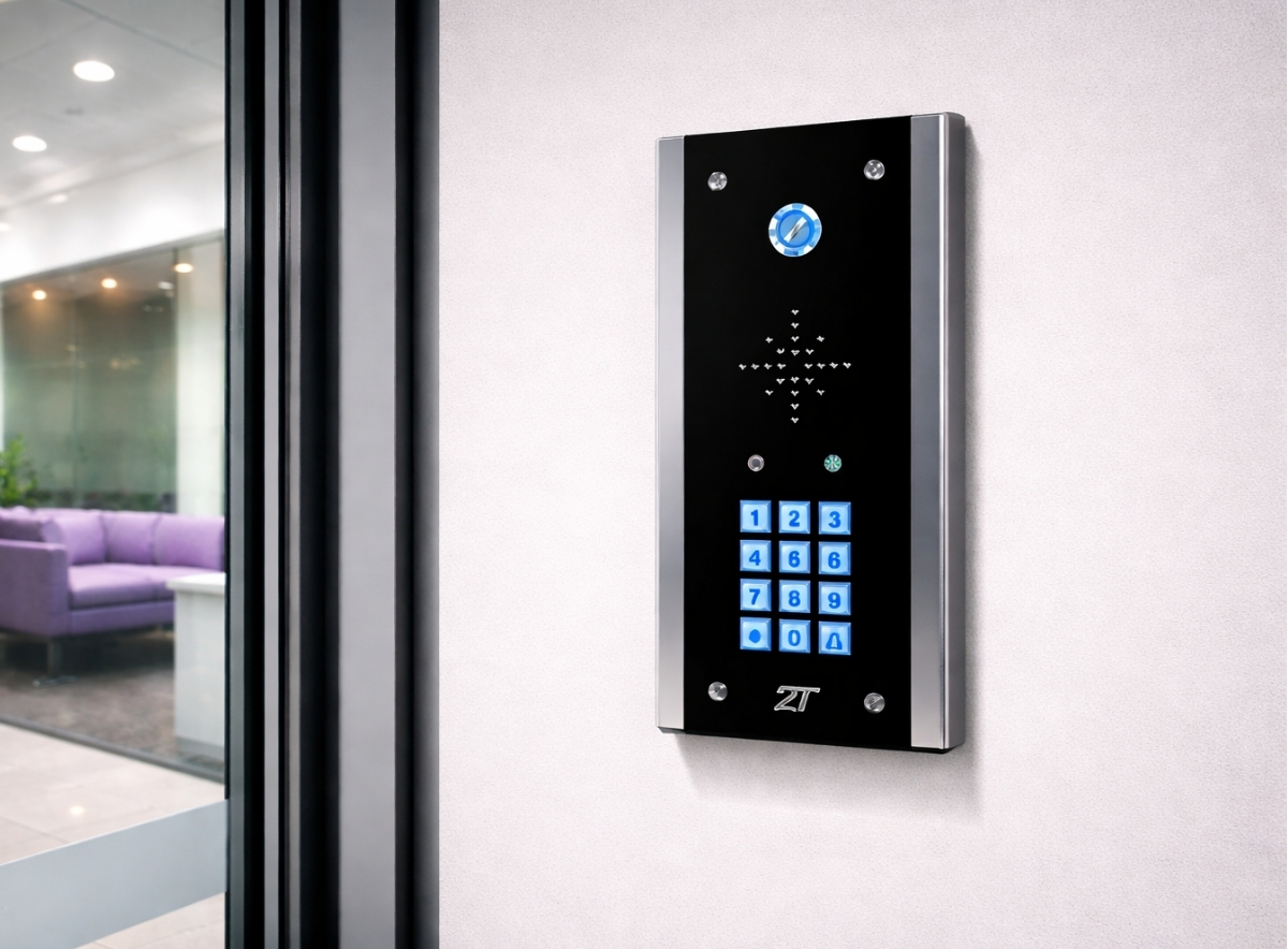 Intercom system for business installed on office wall beside glass door with keypad entry and secure access control