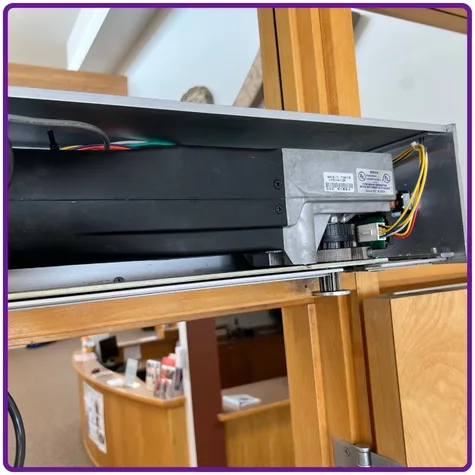 Motor wear inside automatic door mechanism identified during automatic door maintenance